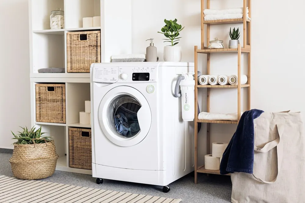 Neat laundry room with a washing machine and folded towels